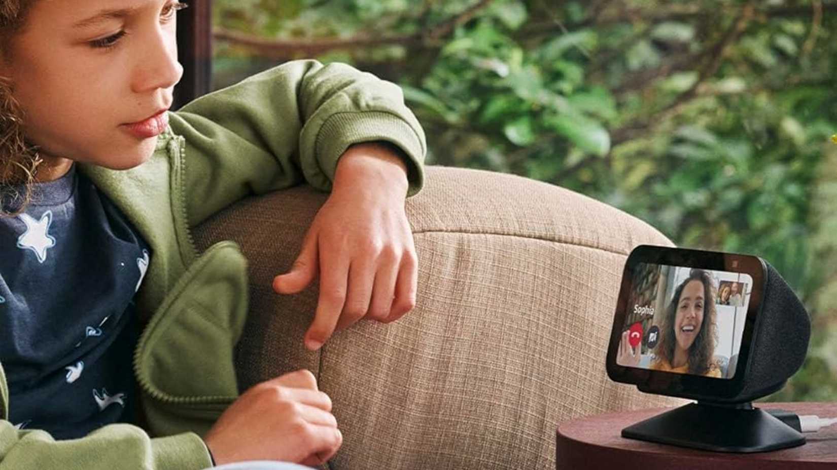 A child talking to an Echo Show.