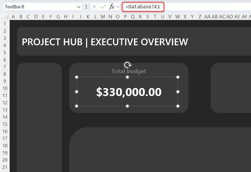 A value is mirrored in an Excel text box from cell K1 in the Database worksheet using a formula in the formula bar.