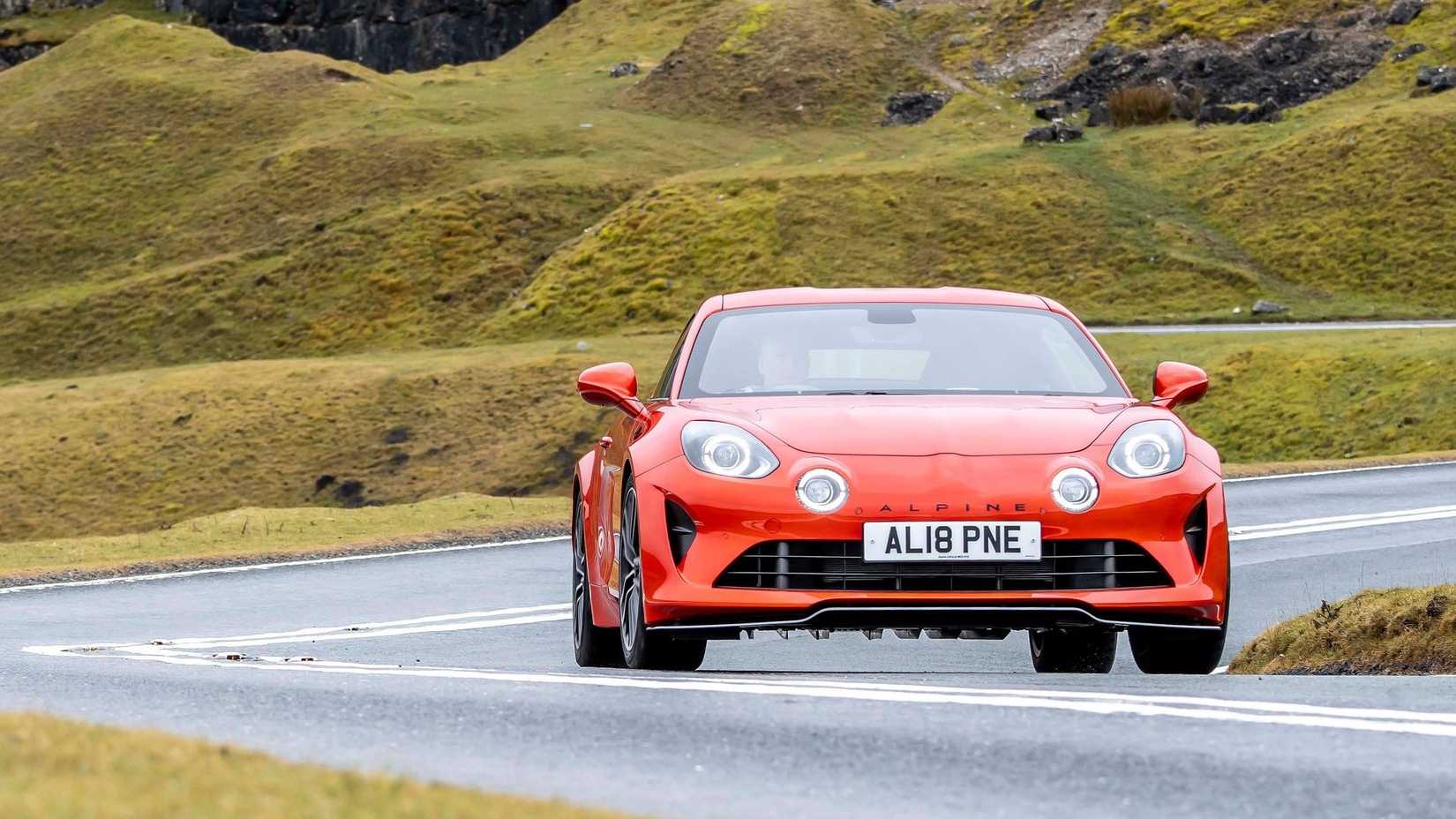 Head-on action shot of a 2022 Alpine A110