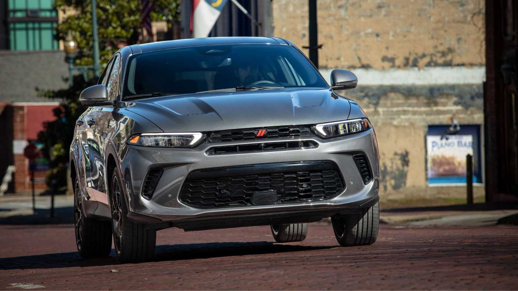 Dynamic front-end shot of a gray 2024 Dodge Hornet.