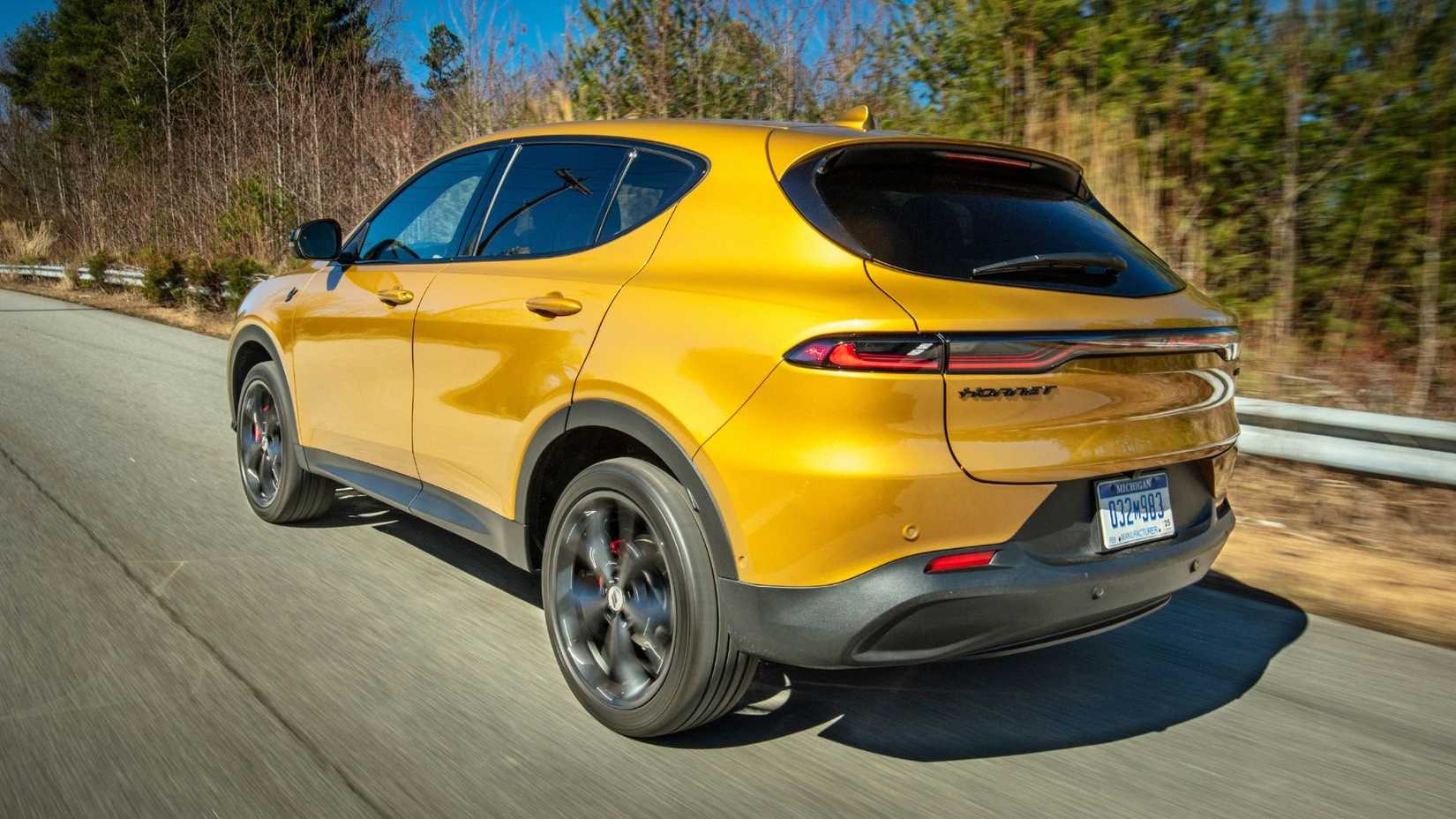 Dynamic rear 3/4 shot of an orange 2024 Dodge Hornet.