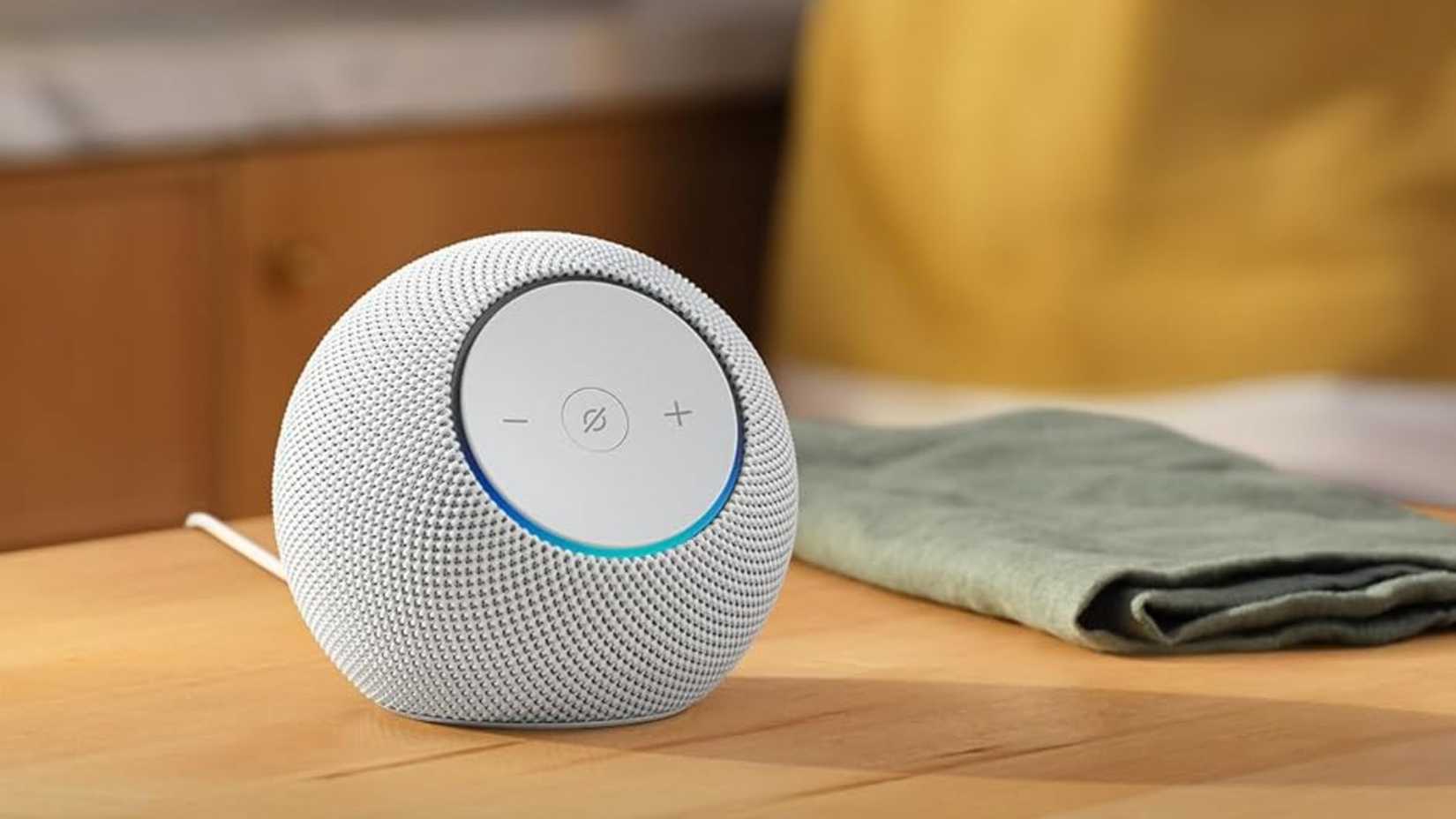 Echo Dot Max on a kitchen table near a person