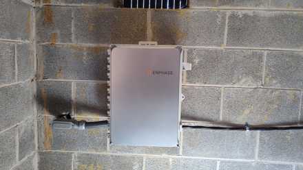 Enphase system controller with conduit running to solar panels.