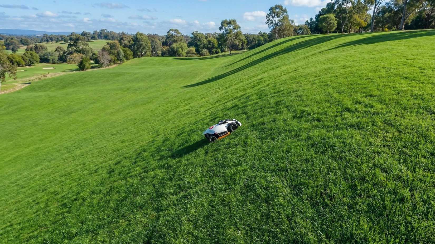 Mammotion Luba 3 robot mower climbs a steep incline.