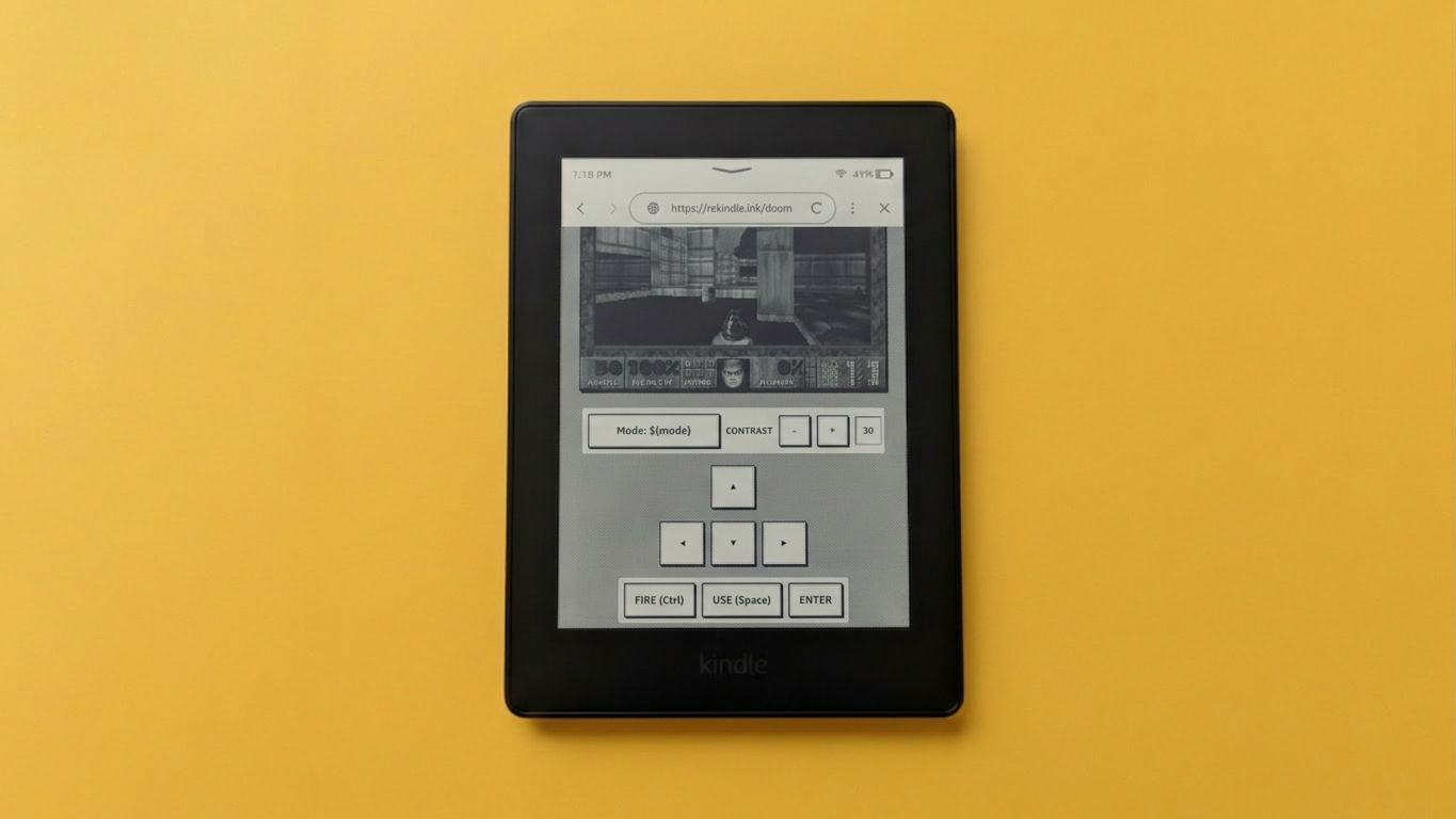 Playing DOOM on a Kindle against a yellow backdrop.
