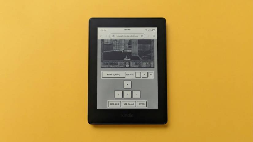 Playing DOOM on a Kindle against a yellow backdrop.