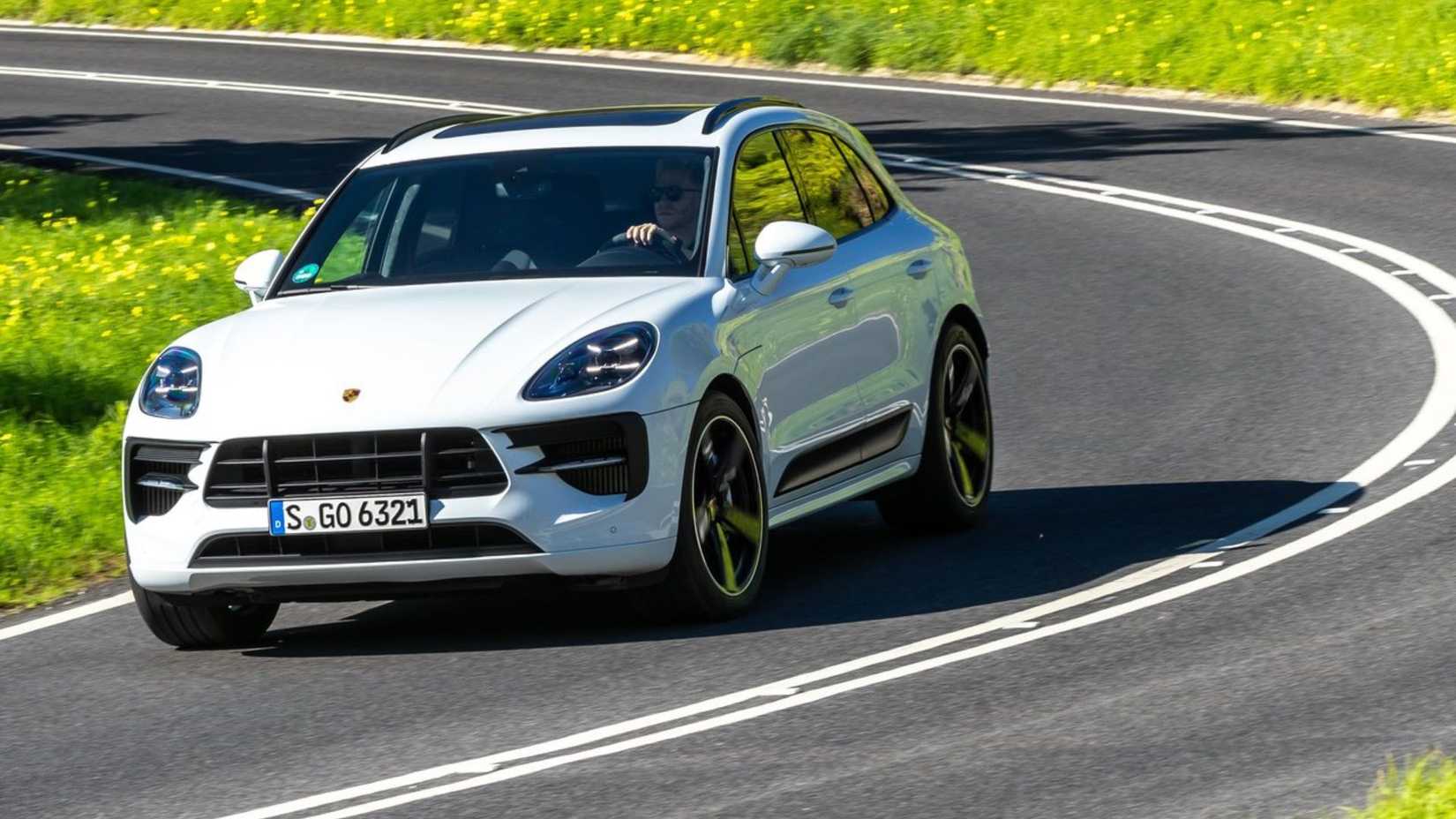 Dynamic front 3/4 shot of a white 2020 Porsche Macan GTS.