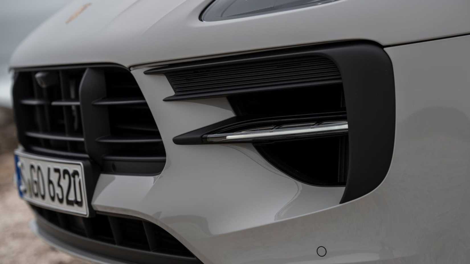 Close-up shot of the front end of a gray 2020 Porsche Macan GTS.