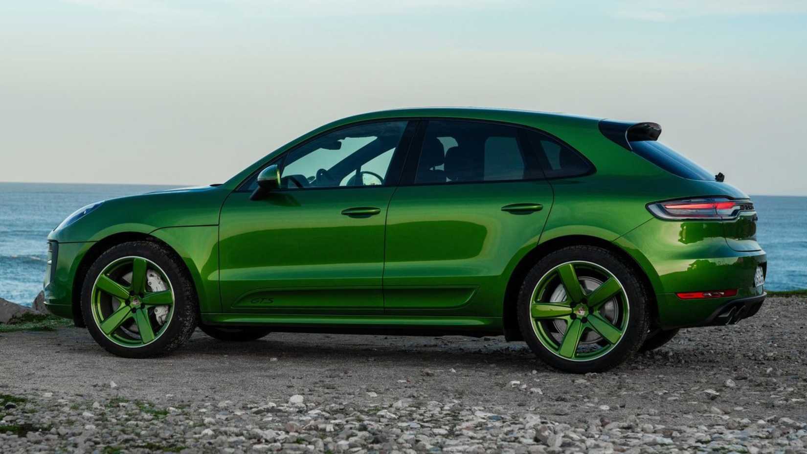 Static side profile shot of a green 2020 Porsche Macan GTS.