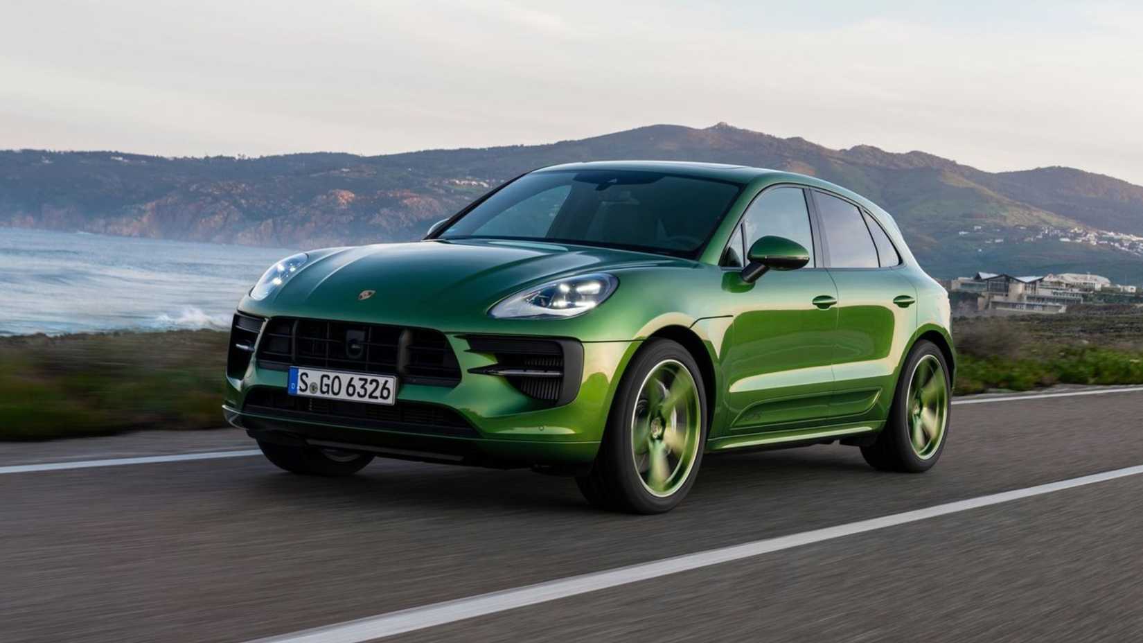 Dynamic front 3/45 shot of a green 2020 Porsche Macan GTS.