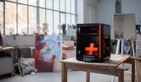 Prusa CORE One+ in an art studio setting.