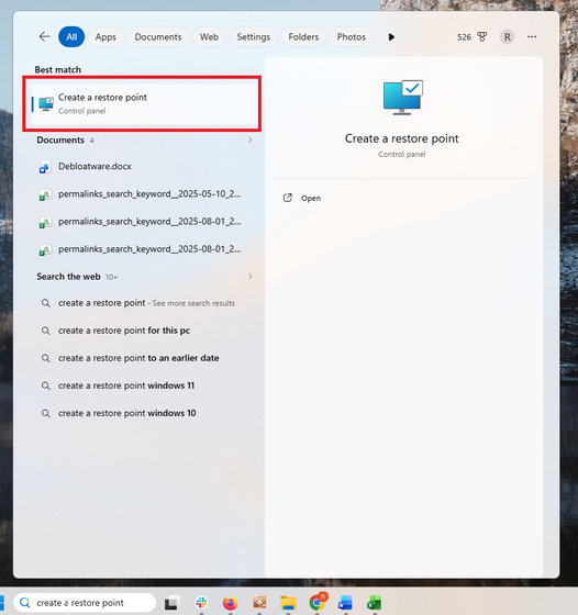 A screenshot of Windows 11 search open to the Windows Recovery settings, Create a restore point highlighted with a red box