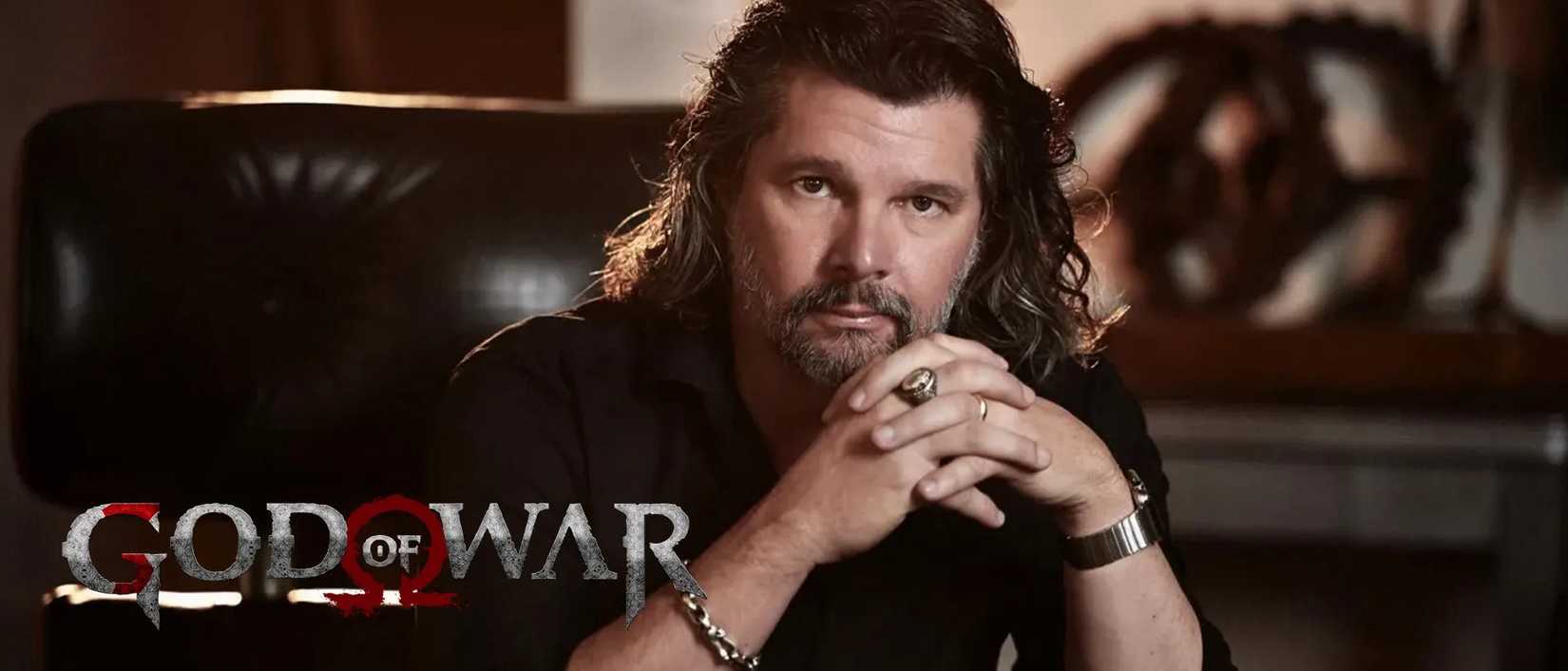 Image of Ronald D. Moore with the God of War logo in the lower left corner.