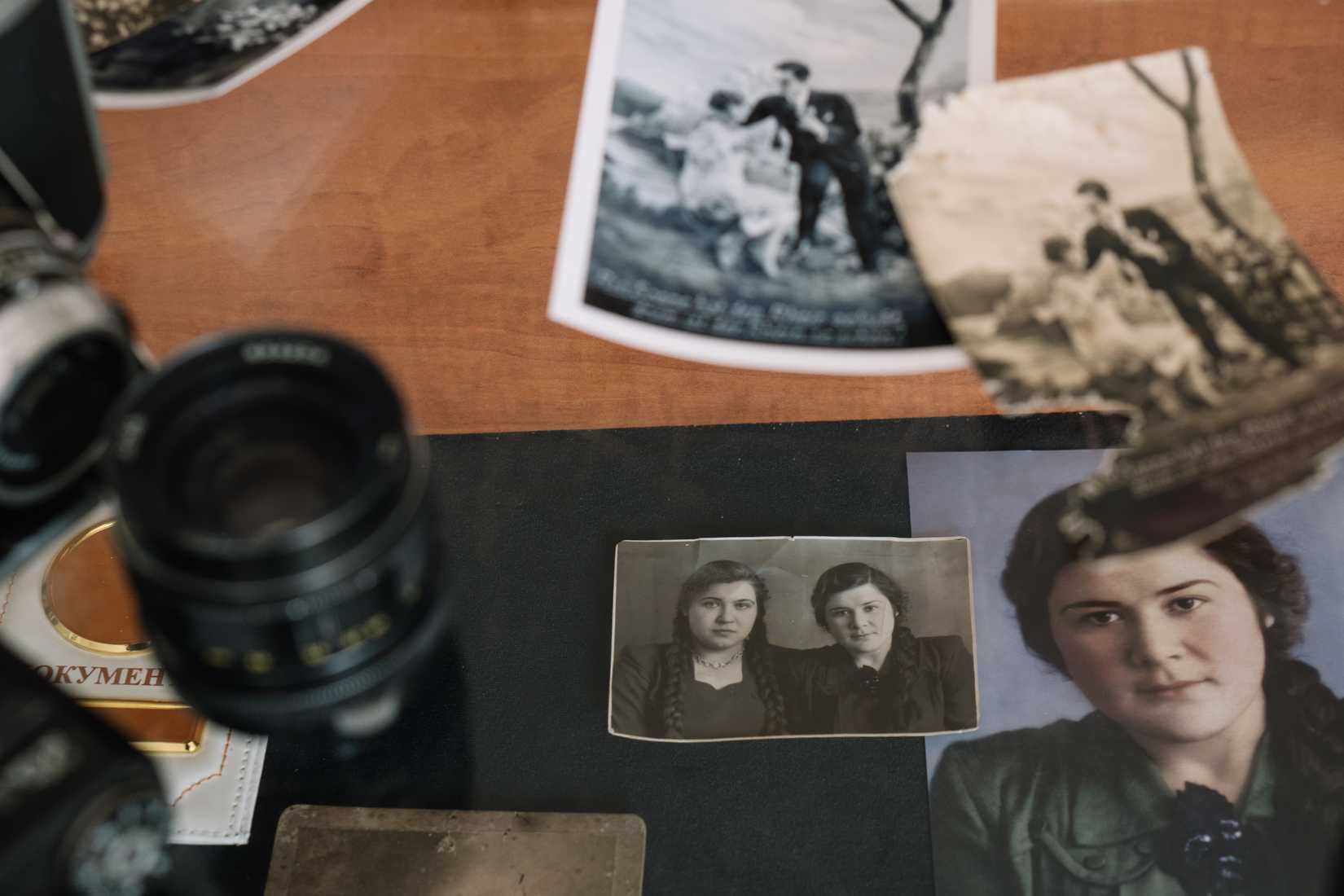 Old photos and tools needed to restore those photos by hand.