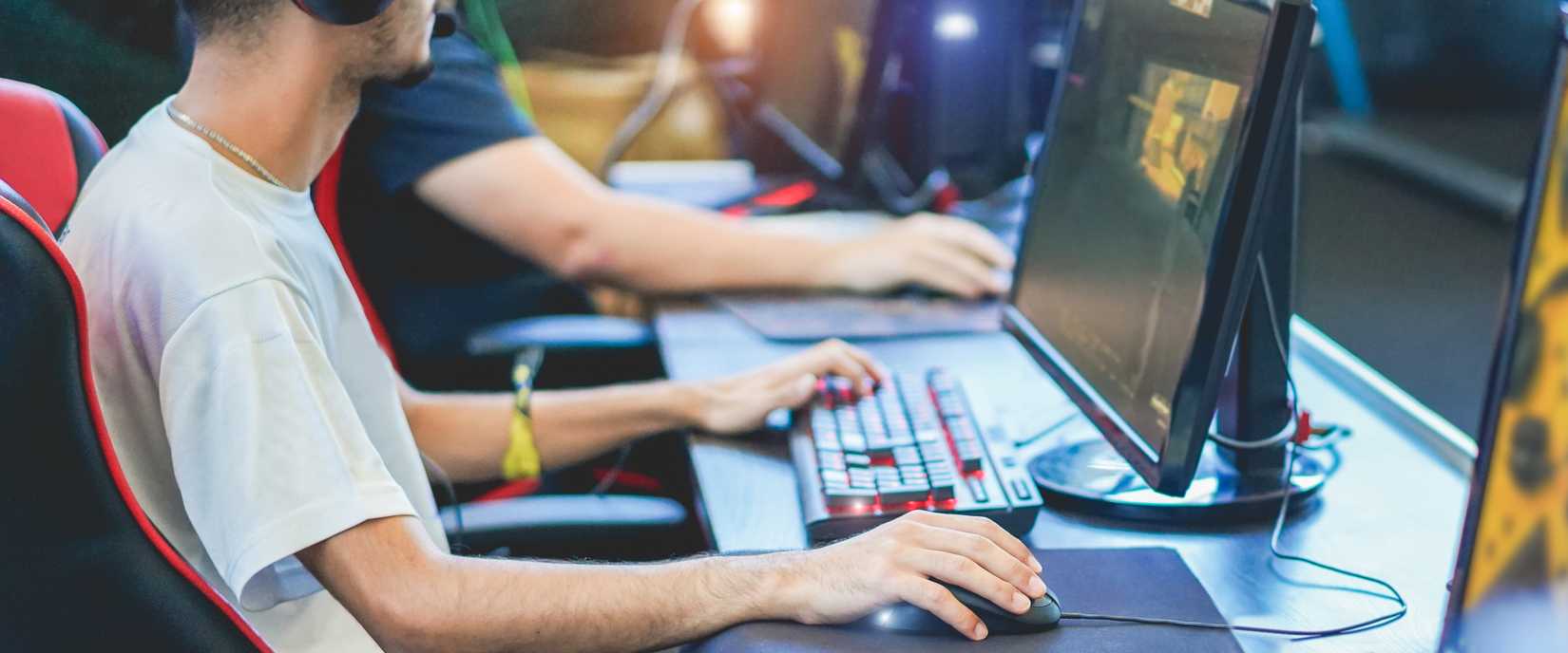 A person plays video games at a LAN party.