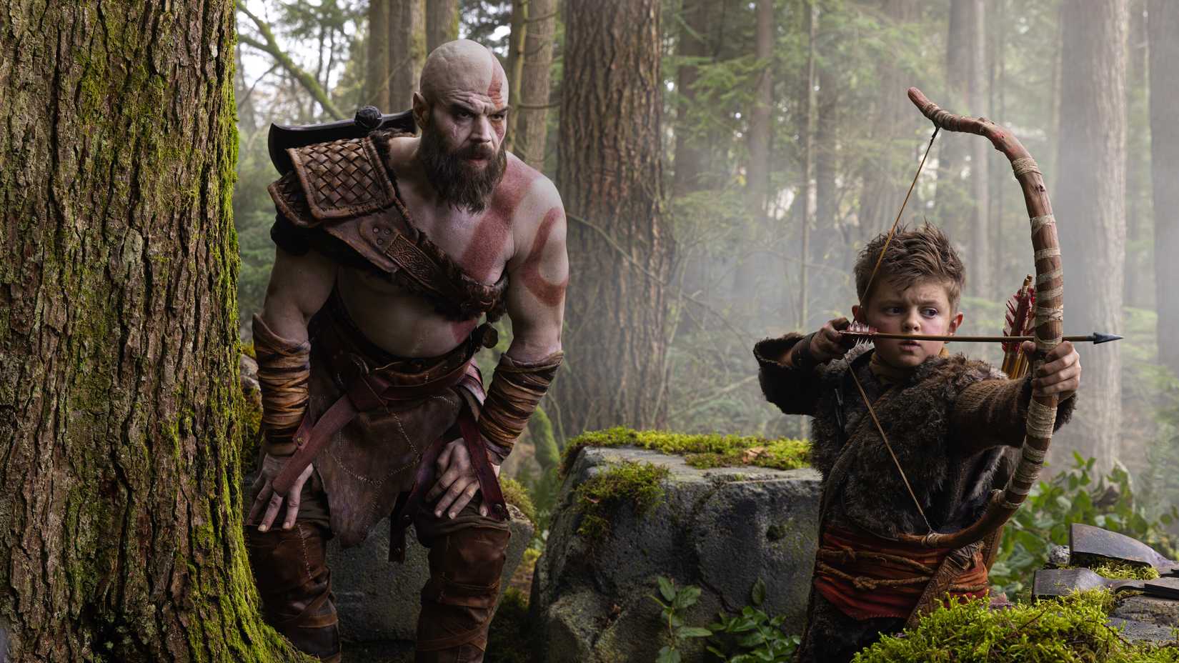 Beginning of production image featuring Kratos and Atreus from God of War