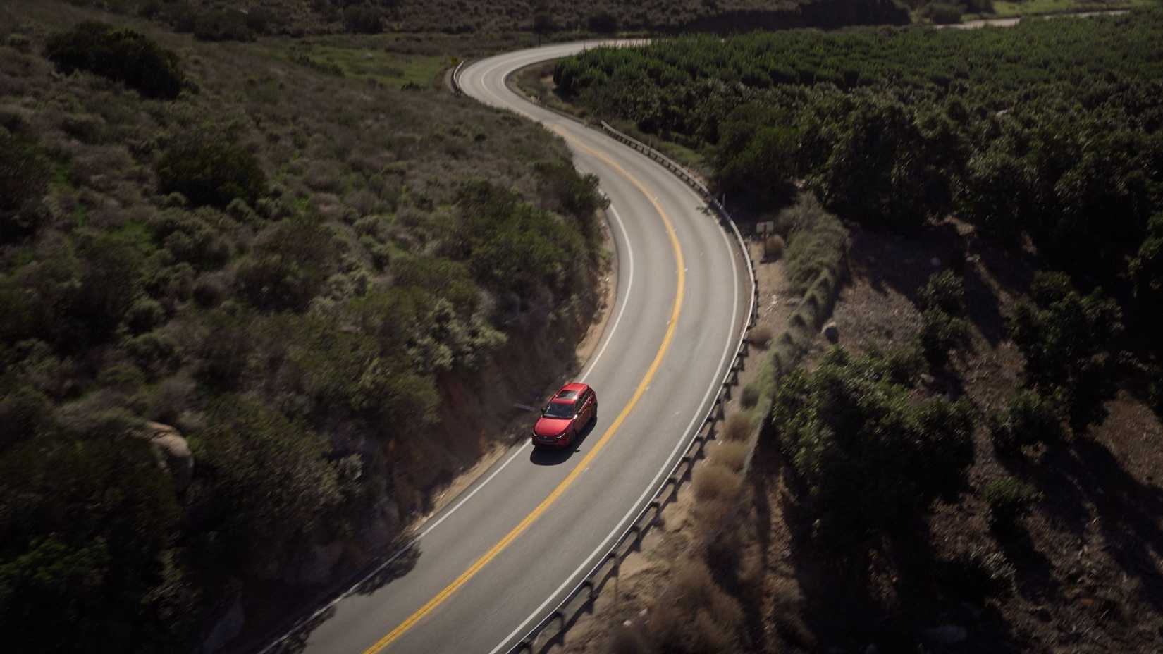 Dynamic overhead front 3/4 shot of a red 2026 Mazda CX-5.