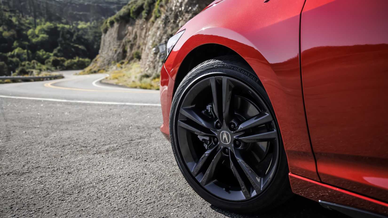 Close up of the front wheel on a 2023 Acura Integra A-Spec