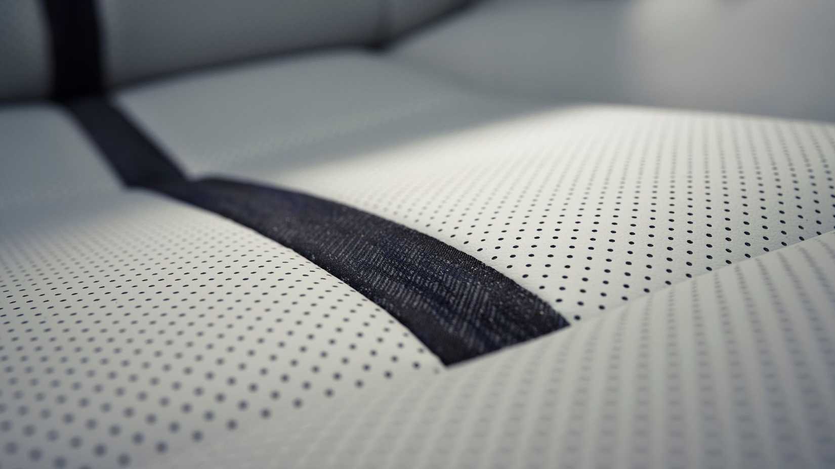 Close-up shot of the perforated leather seats inside the cabin of a 2024 Mazda CX-90.