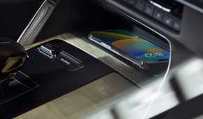 Close-up shot of the wireless charger in the center console of a 2024 Mazda CX-90.