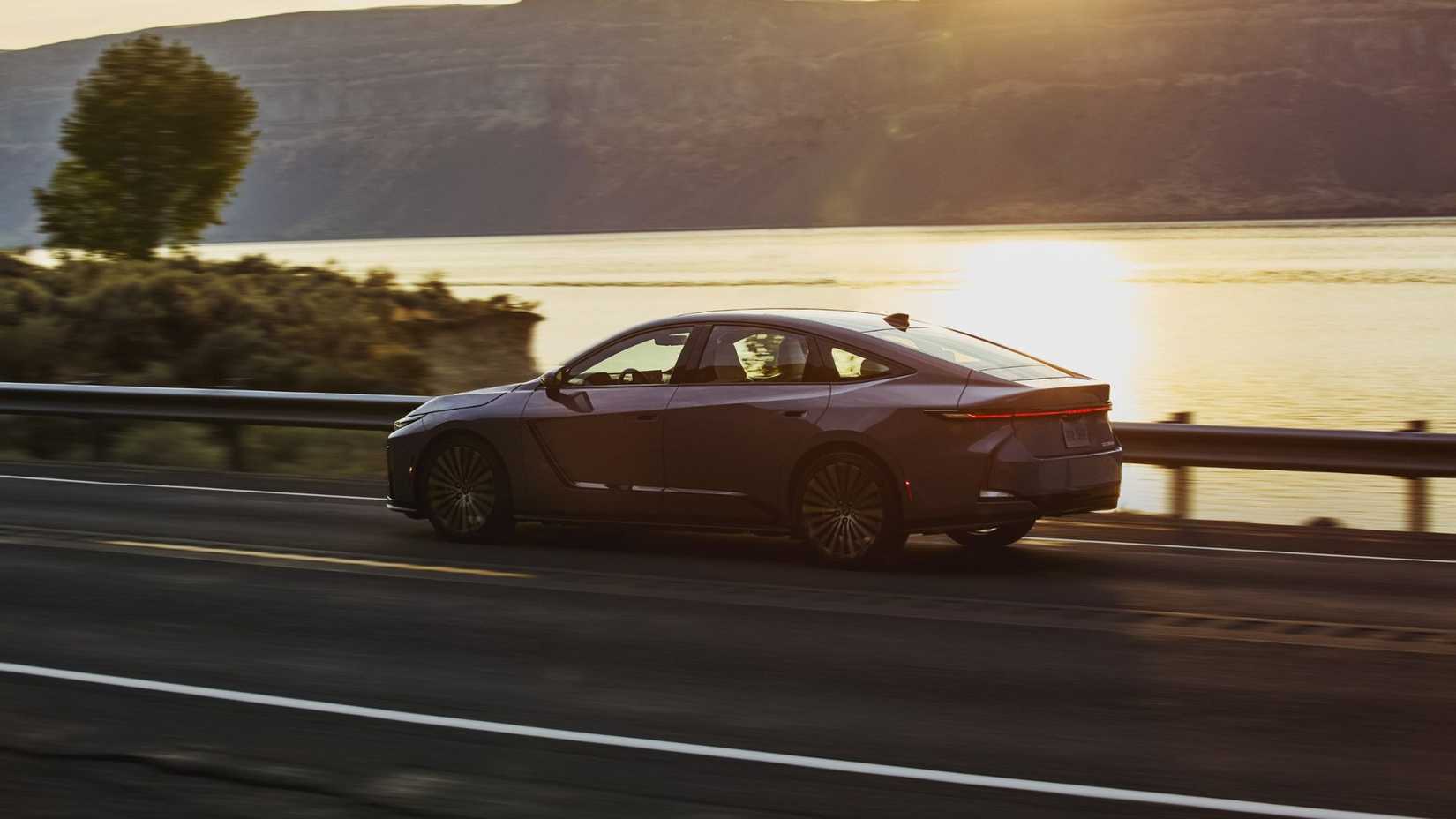 Dynamic side profile shot of a 2026 Lexus ES 350e.