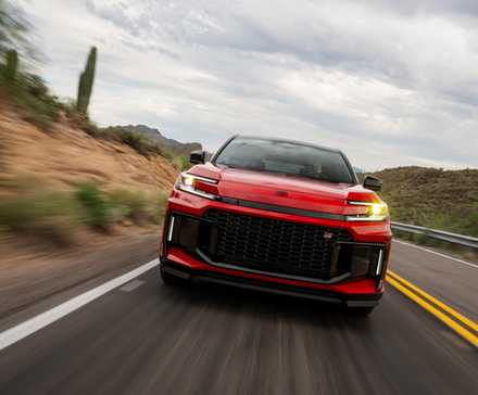 Head-on action shot of a 2026 Toyota RAV4 PHEV GR Sport