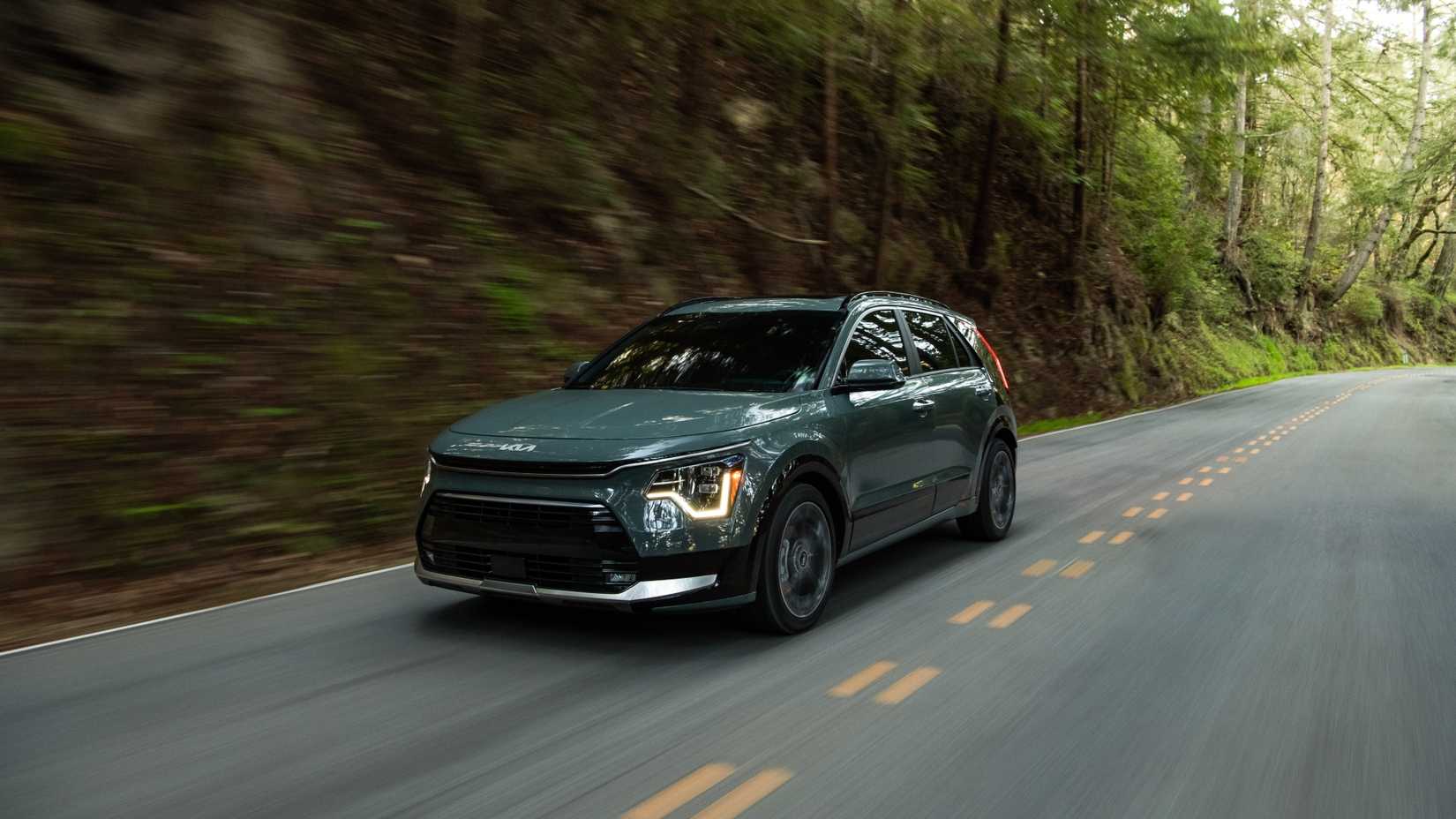 Front 3/4 action shot of a 2026 Kia Niro