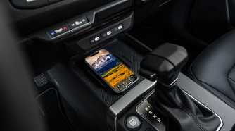Close up of the smartphone charging pad in a 2027 Kia Seltos