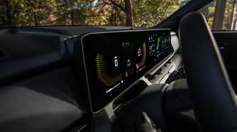 Close up shot of the digital gauge cluster and infotainment screen in a 2027 Kia Seltos