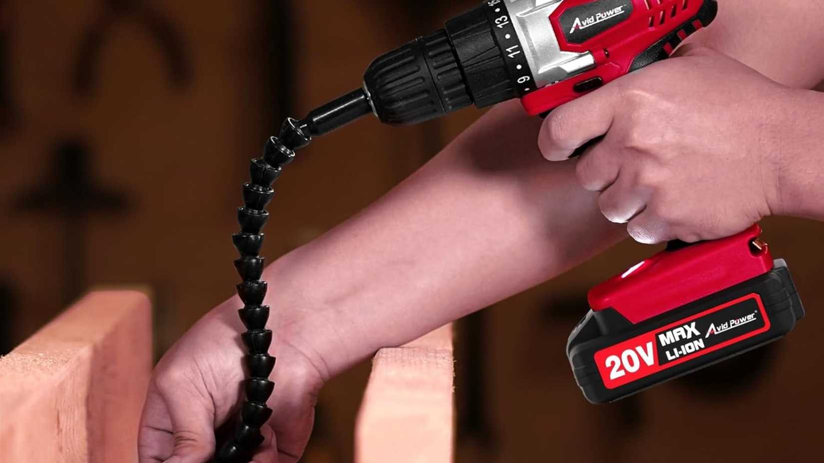 A red drill being used in a wonky way