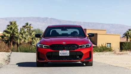 Static front-end shot of a red 2023 BMW M340i.