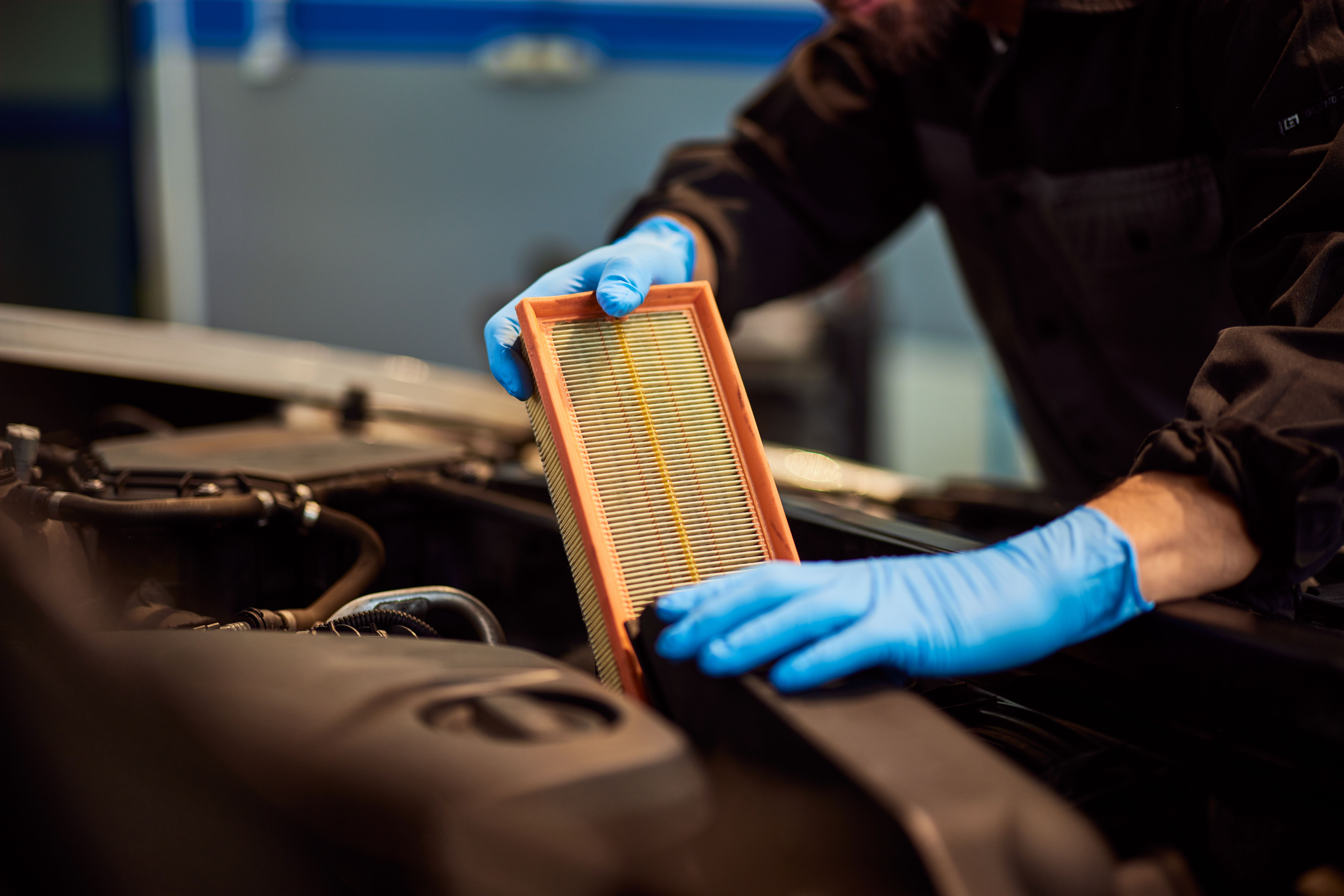 Car Mechanic Changing the Air Filter