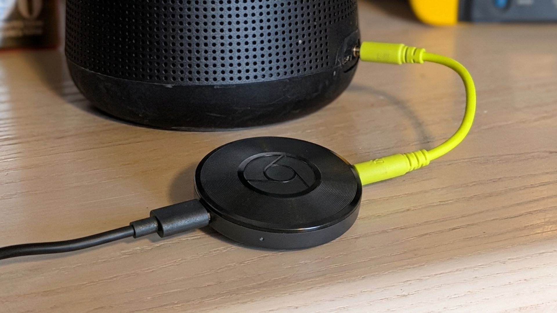 Chromecast Audio on shelf with speaker