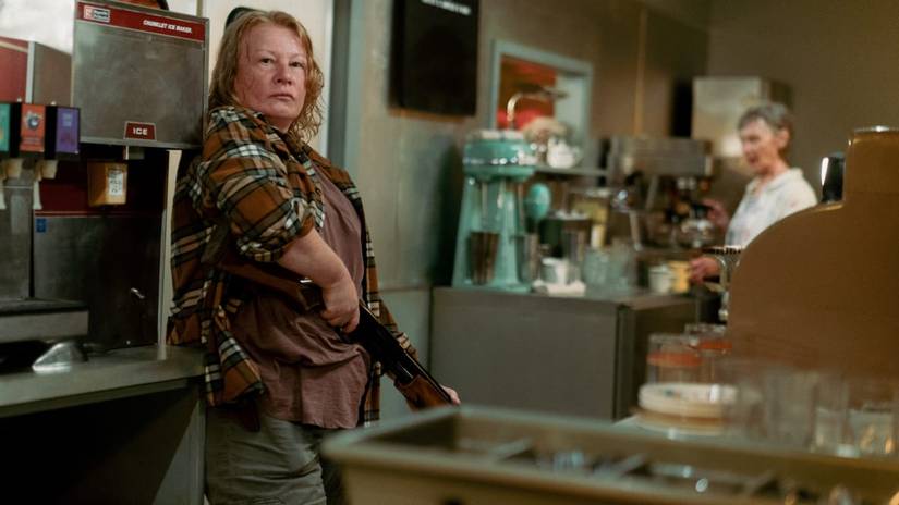Donna on alert, holding a shotgun, in From, season 2 episode 2.
