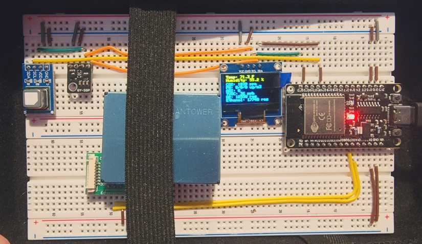ESP32 project with ESP32 mounted to a breadboard and jumper wires and sensors going all over the place.