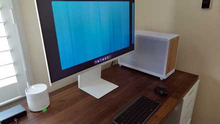 Fedora Silverblue on a Samsung Smart Monitor M8 with desktop tower, keyboard, and mouse.