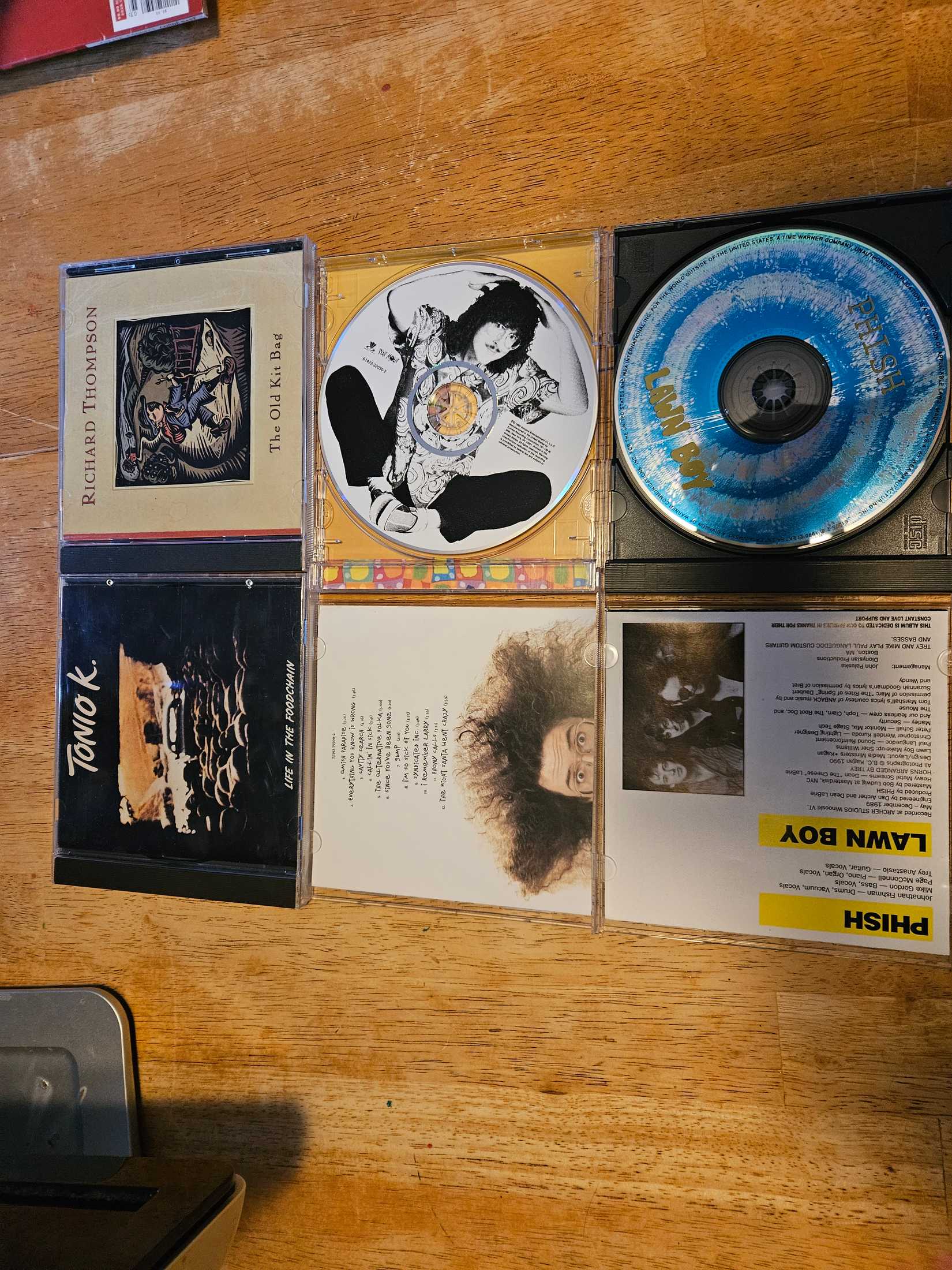 Four CDs on a table
