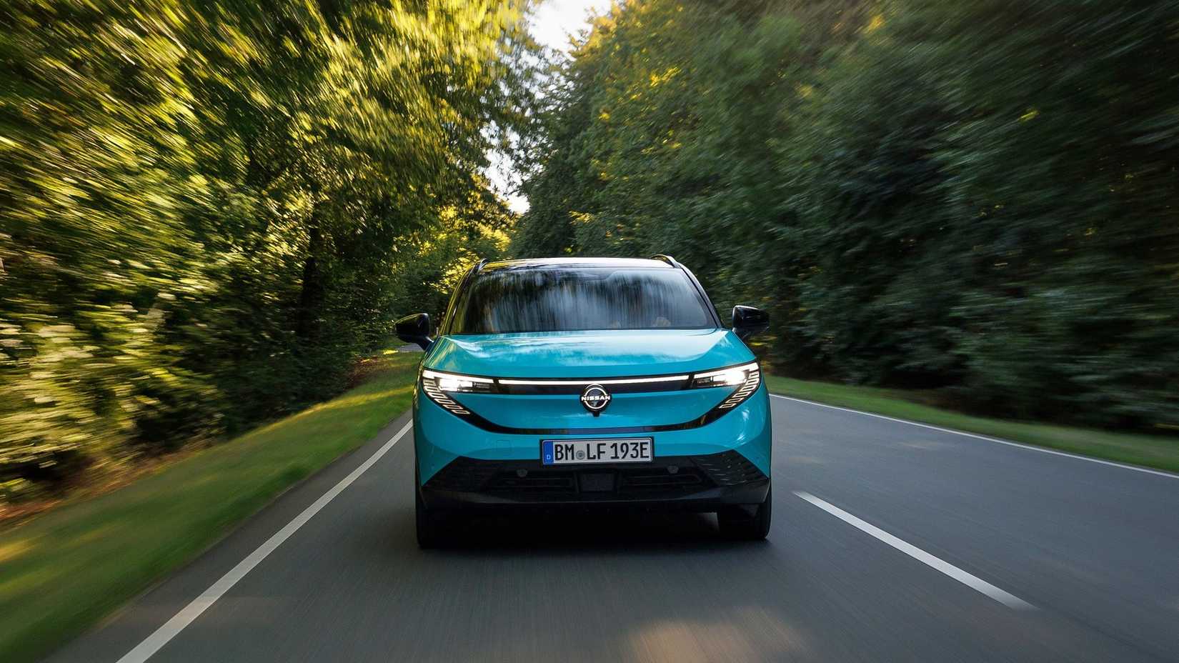 Head-on action shot of a 2026 Nissan Leaf