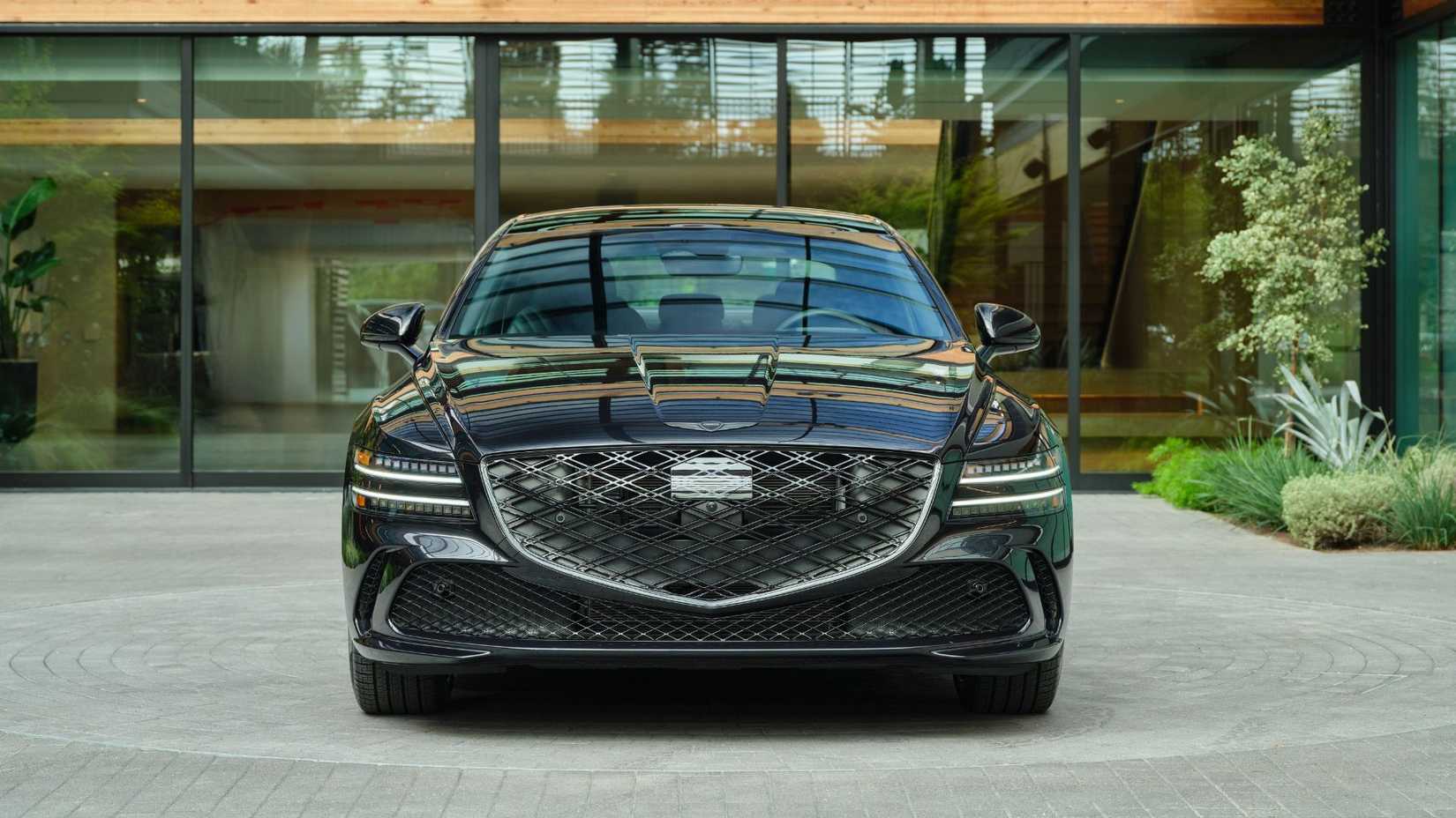 Static front-end shot of a black 2026 Genesis G80 Prestige Black.