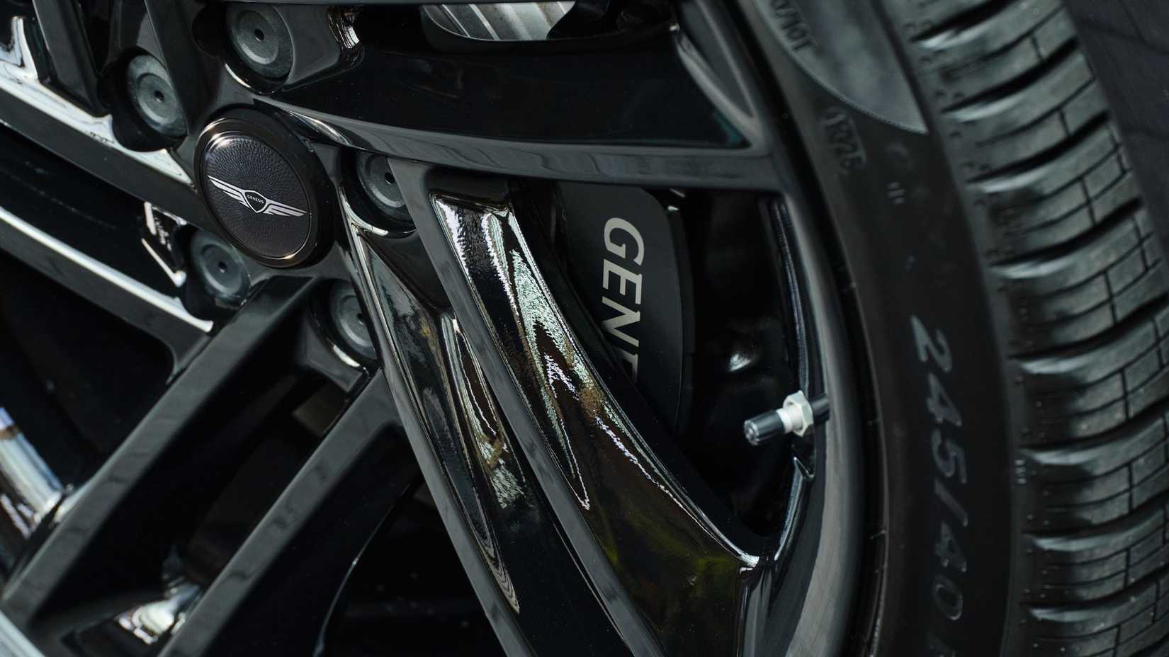 Close-up shot of the alloy wheel on a black 2026 Genesis G80 Prestige Black.
