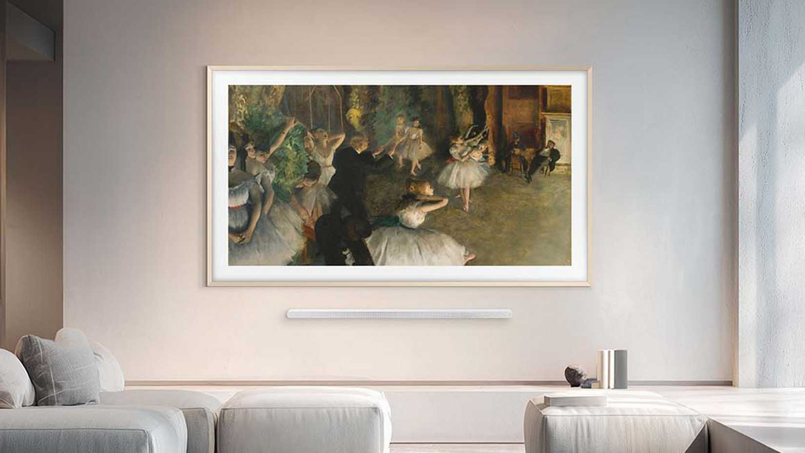 Samsung 2026 The Frame Pro TV mounted on a wall with a soundbar.