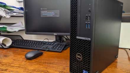 A Dell office PC sits on a desk.