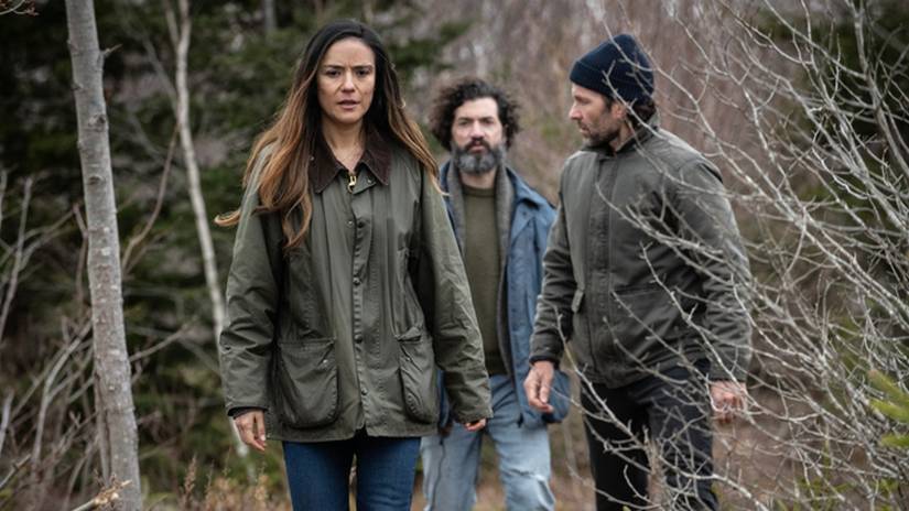 Main characters Tabitha, Jade, and Jim walking through the woods in From.