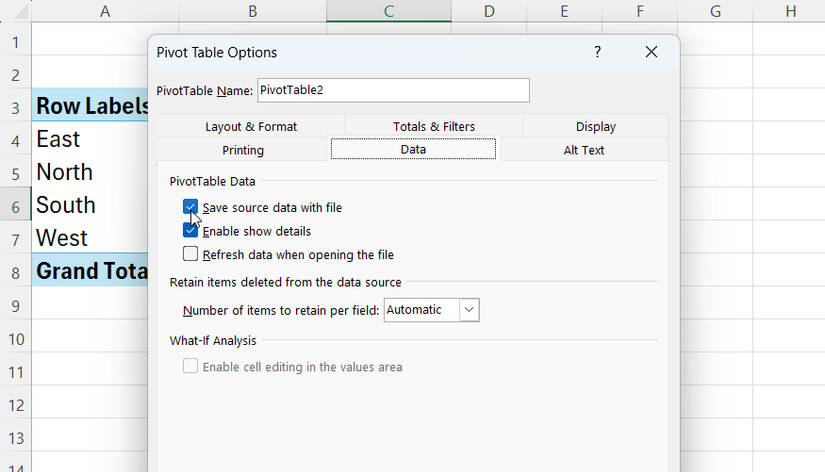 The Excel Pivot Table Options dialog box with the Data tab selected, highlighting the 'Save source data with file' checkbox.