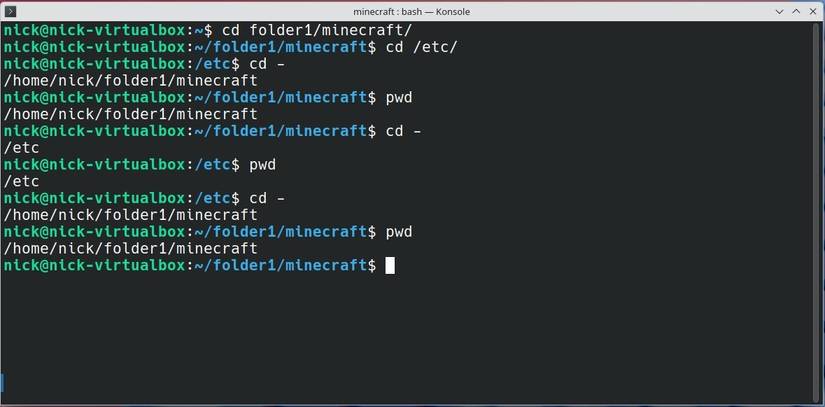 Moving back and forth between directories using the cd - command. 