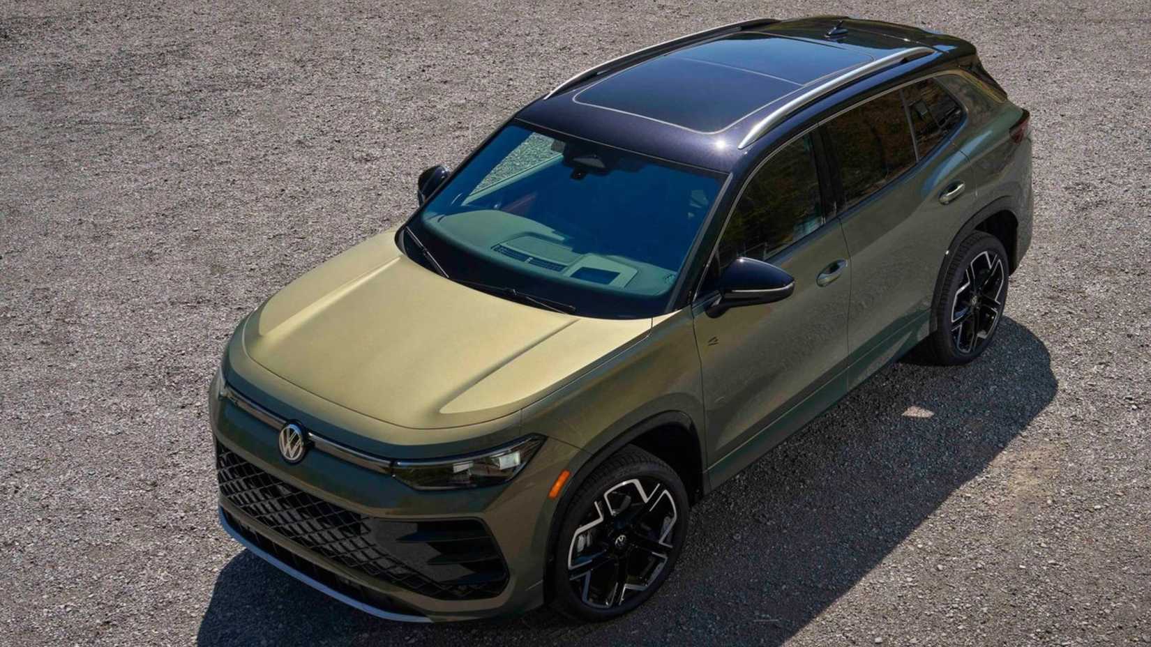 Overhead front 3/4 shot of a green 2025 Volkswagen Tiguan.