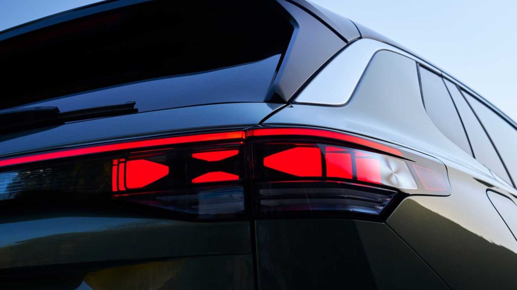 Close-up shot of the tail light on a green 2025 Volkswagen Tiguan.