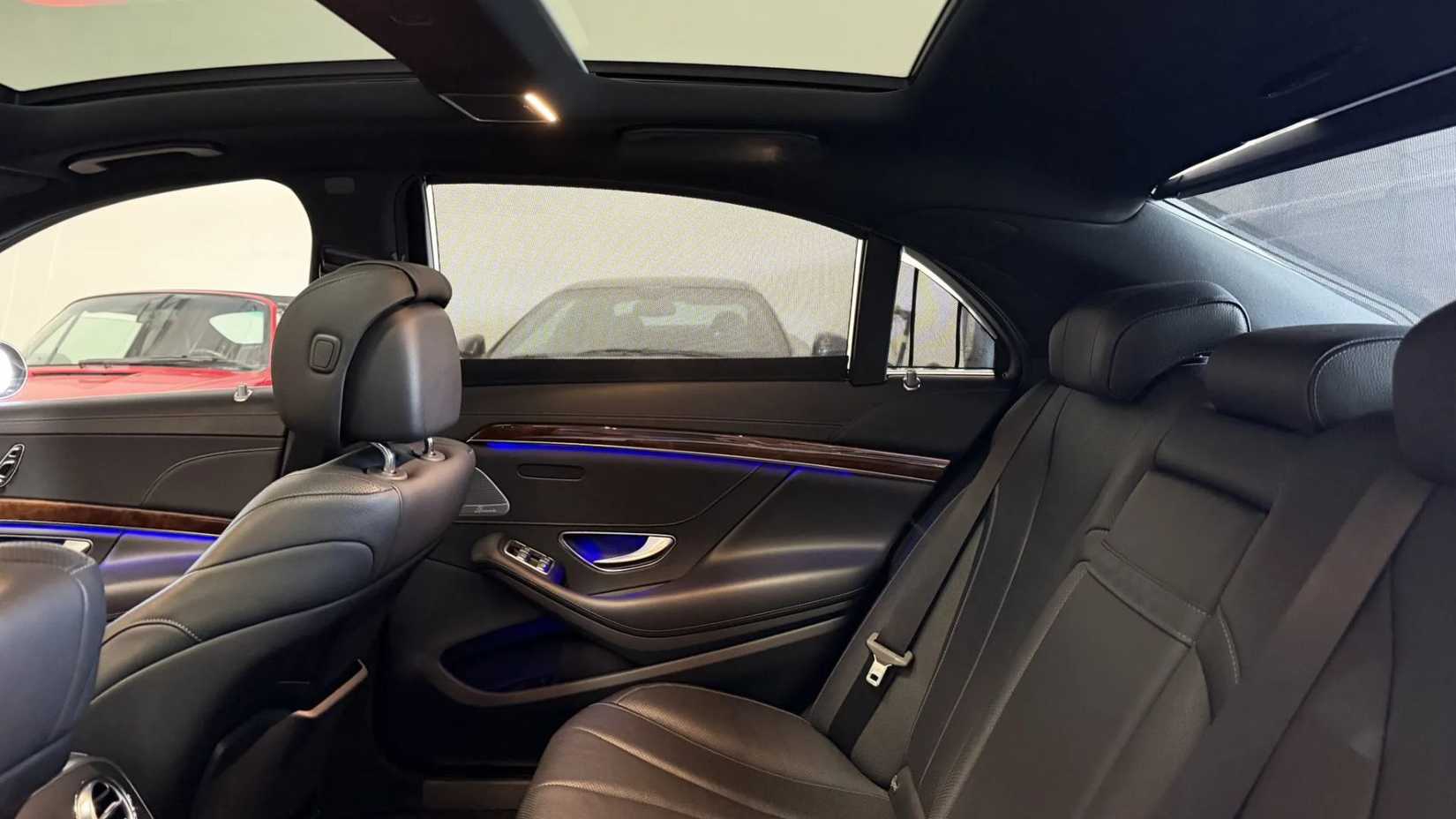 Shot of the rear seats inside the cabin of a 2015 Mercedes-Benz S550.