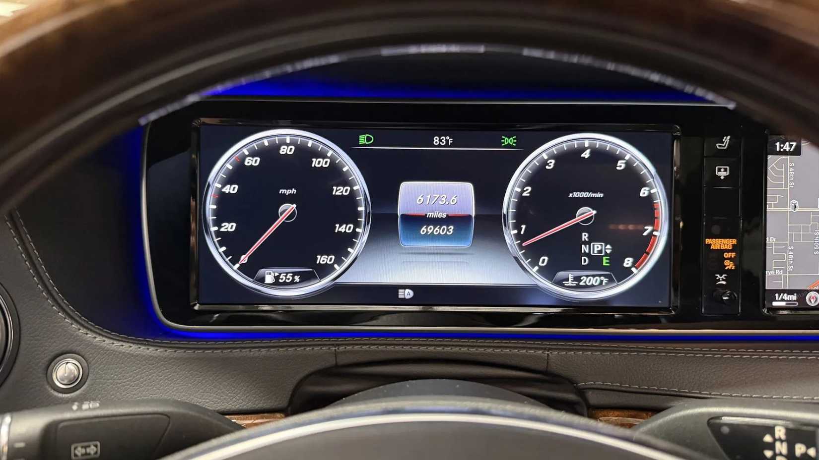 Close-up shot of the digital instrument cluster on the dashboard on a 2015 Mercedes-Benz S550.