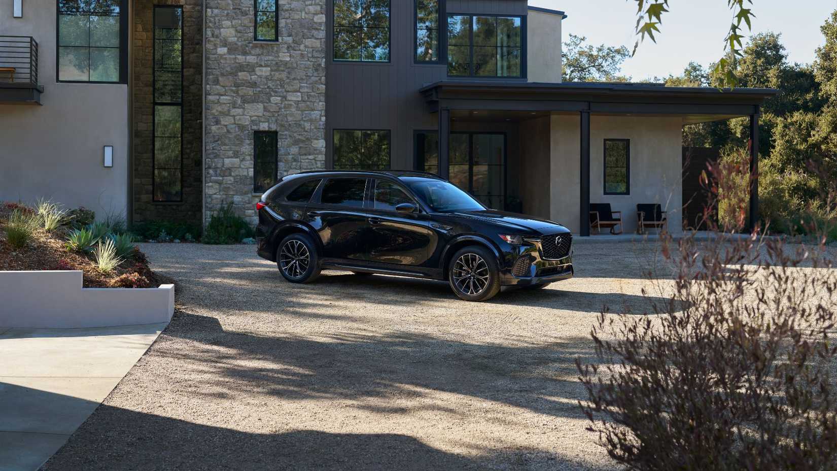 Static side profile shot of ablack 2026 Mazda CX-70.